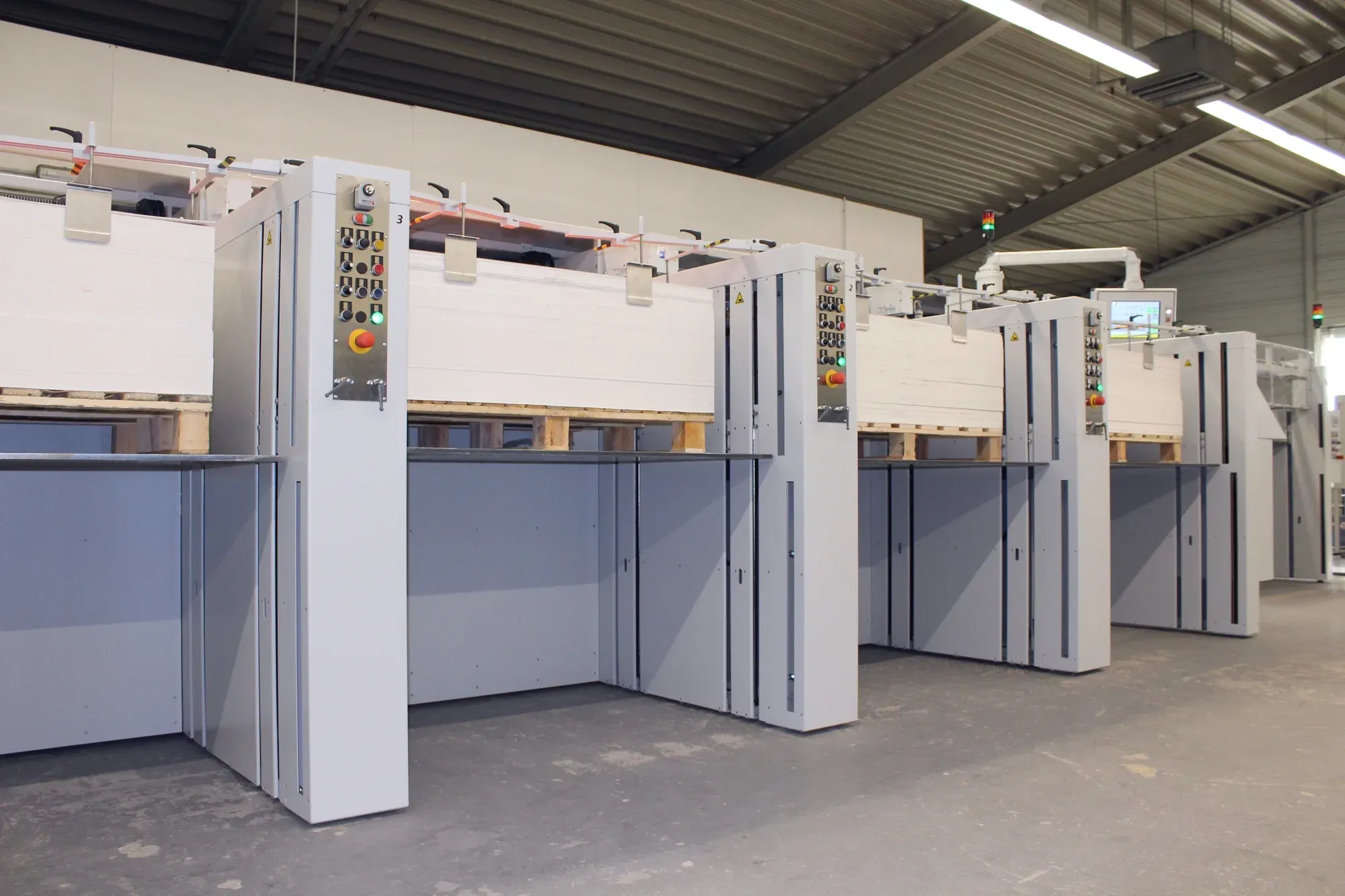 MKW GIANT collator pockets loaded with full press skids of carton board